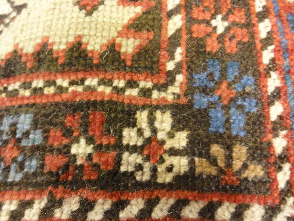 Antique Caucasian Shirvan Botteh Motif. Antique piece of woven carpet art sold by the Santa Barbara Design Center, Rugs and More in Santa Barbara, CA