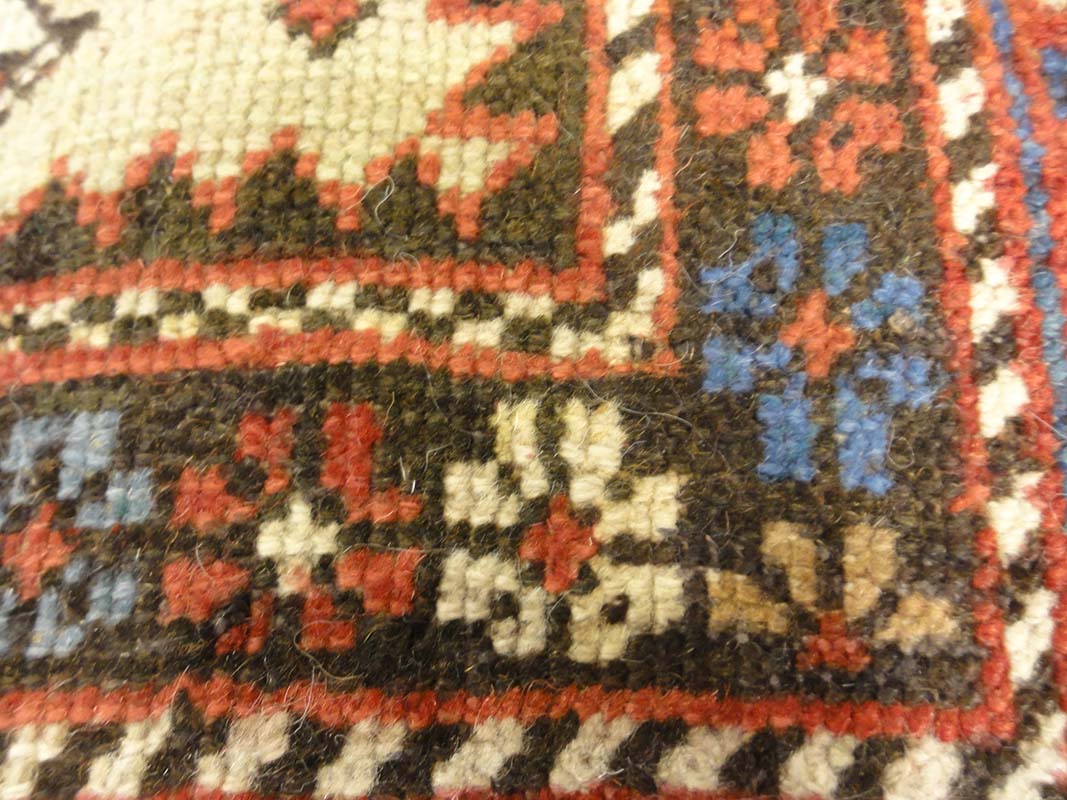 Antique Caucasian Shirvan Botteh Motif. Antique piece of woven carpet art sold by the Santa Barbara Design Center, Rugs and More in Santa Barbara, CA