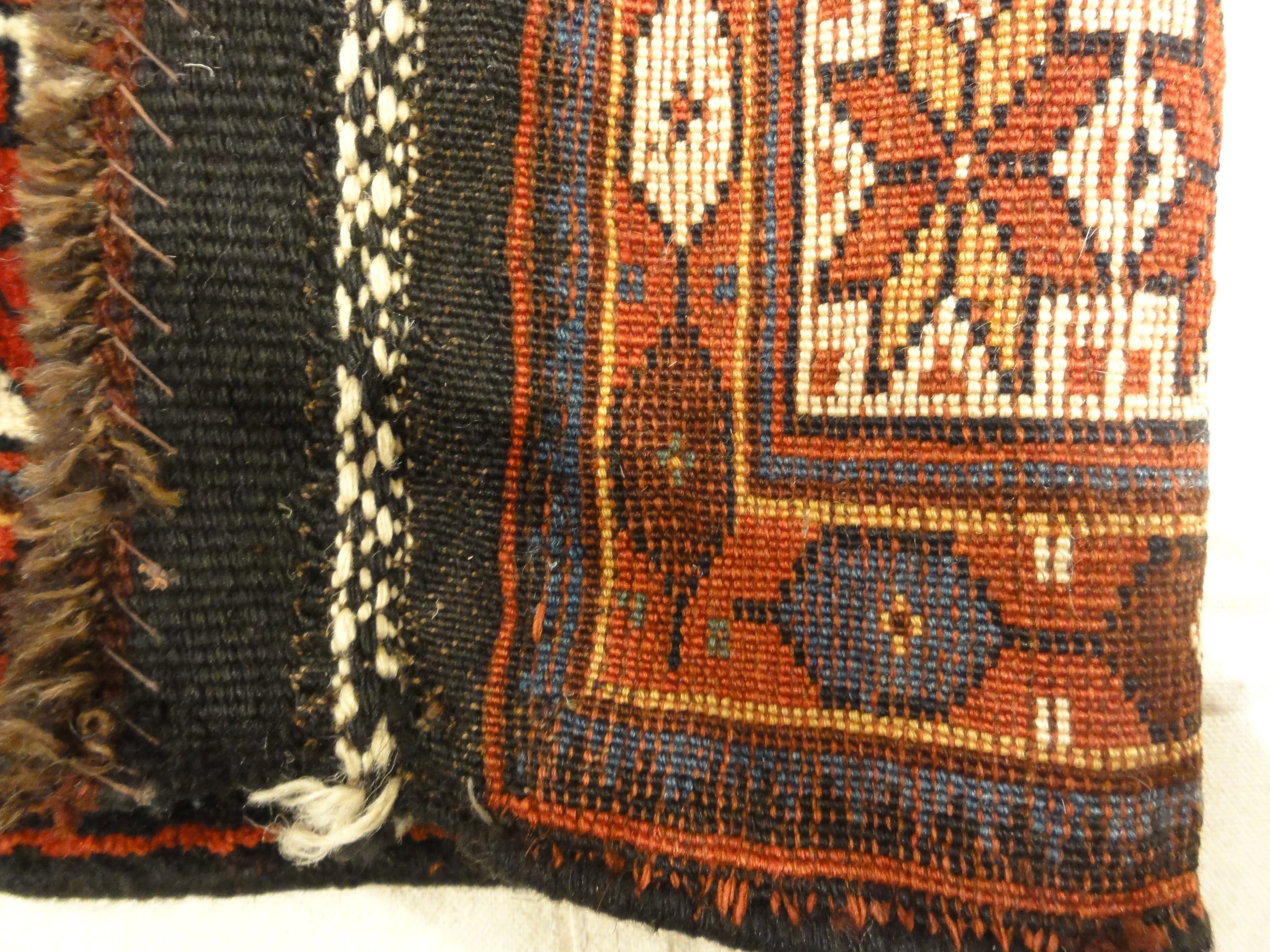 Kurdish Saddle Bag. A piece of genuine authentic antique woven carpet art sold by Santa Barbara Design Center, Rugs and More.