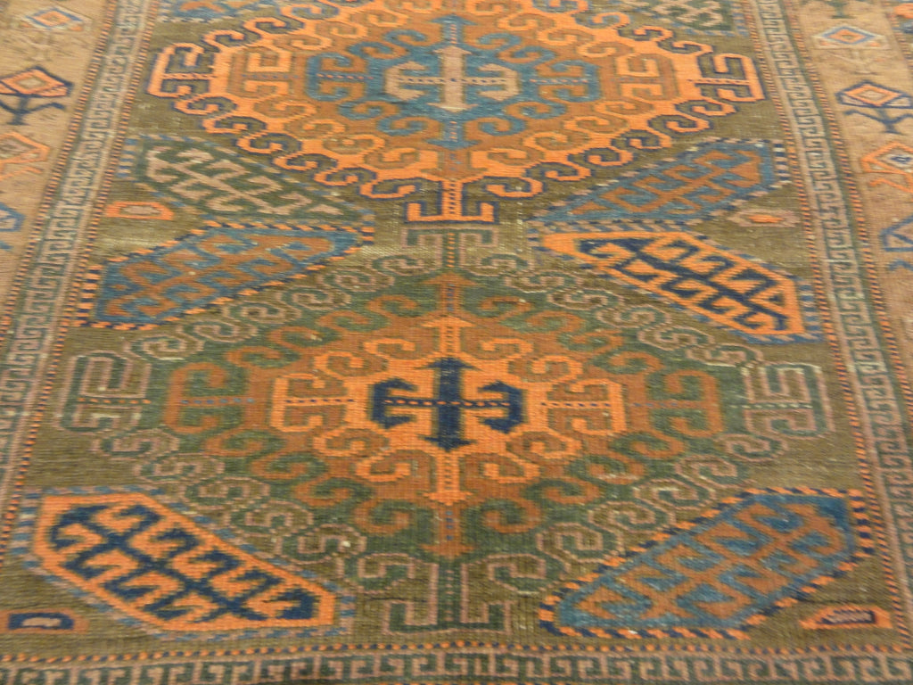 An antique original Mushwani Baluch rug handwoven in Afghanistan. A piece of genuine, authentic woven carpet art. Sold by Santa Barbara Design Center.