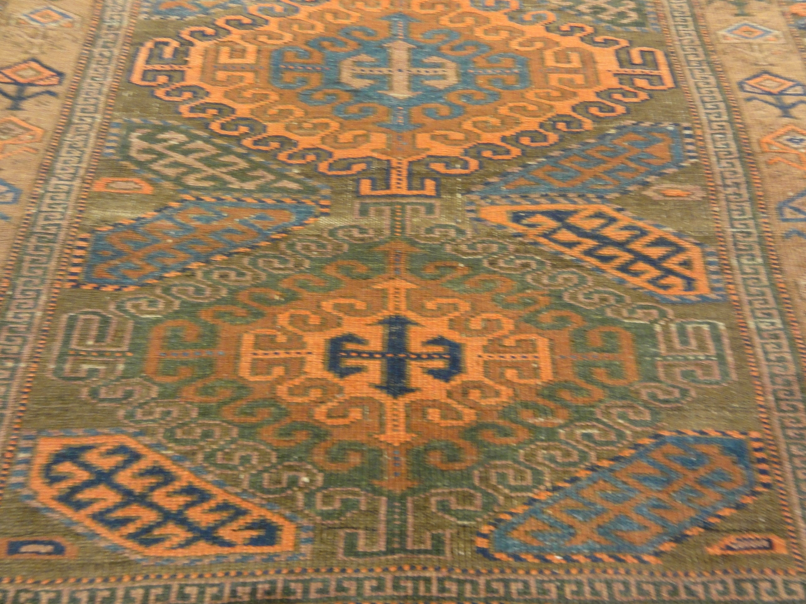 An antique original Mushwani Baluch rug handwoven in Afghanistan. A piece of genuine, authentic woven carpet art. Sold by Santa Barbara Design Center.