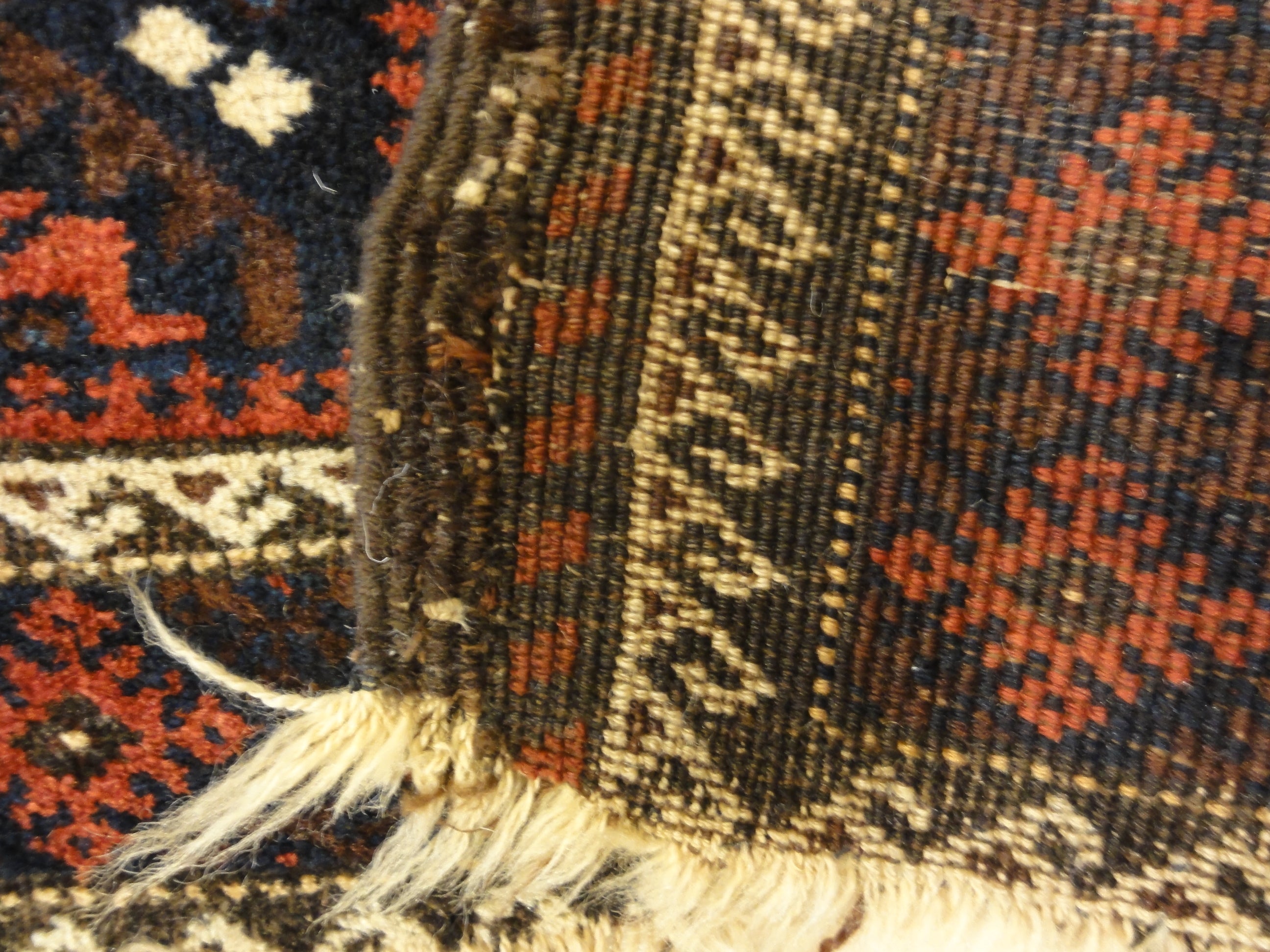 An antique and original burial Baluch dated rug. Dated on all four corners. Used as a casket covering. Sold by Santa Barbara Design Center.