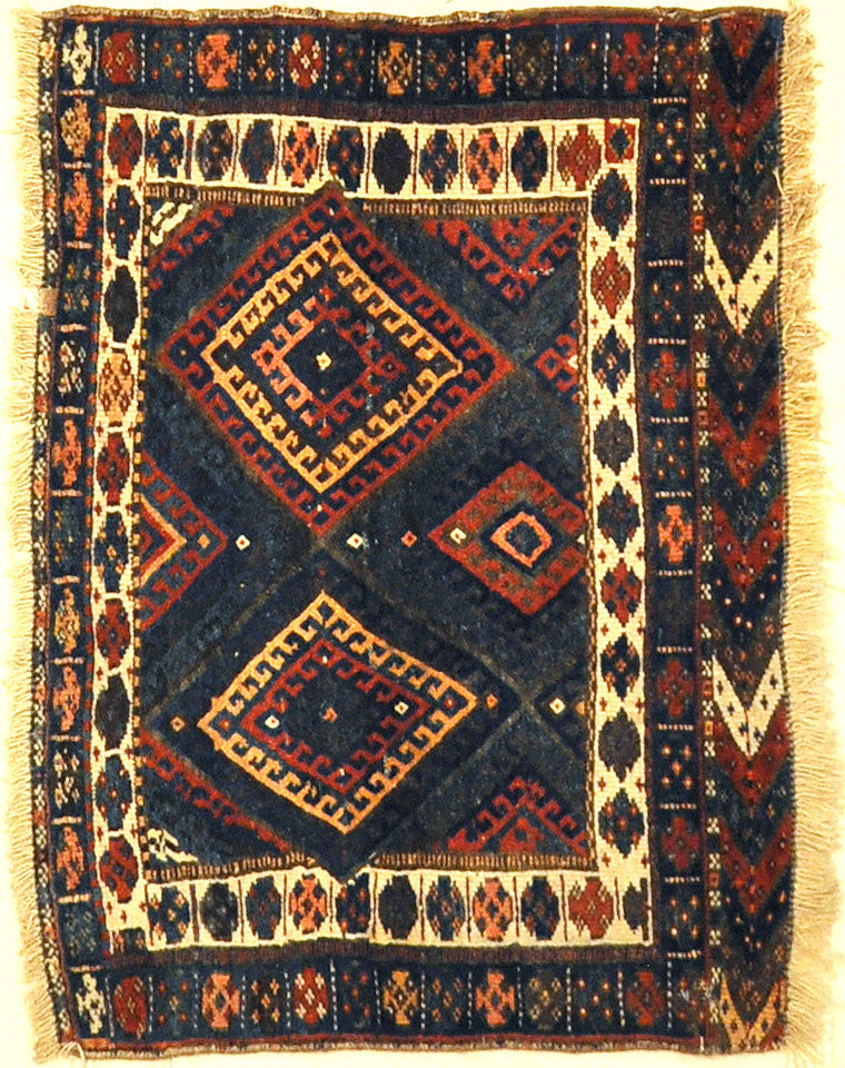 Kurdish Bagface Jaf Kurd. A genuine, antique piece of woven carpet art sold by Rugs & More in the Santa Barbara Design Center.