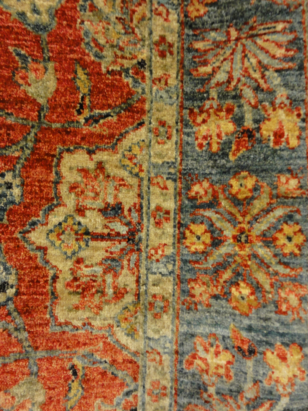 Fine Mughal Runner hand knotted of fine wool and organic dyes. Featuring reds and blues.