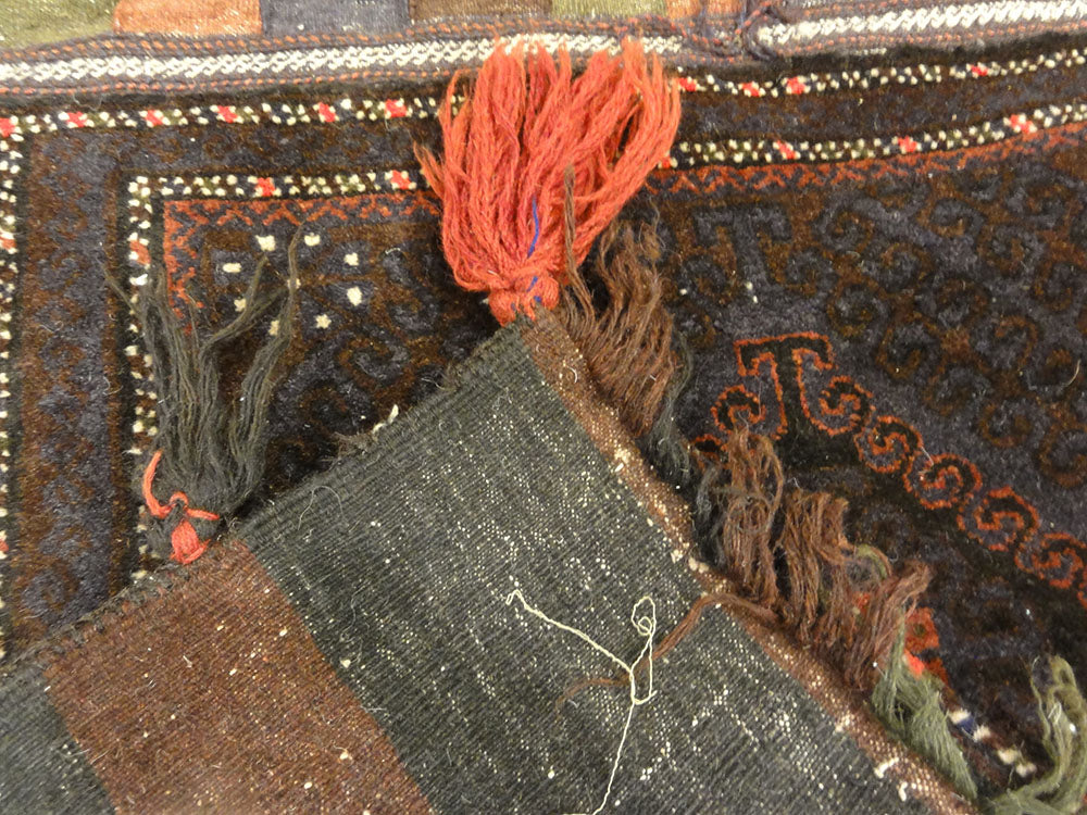Antique Beluch Saddle Bag. A piece of genuine authentic antique woven carpet art sold by Santa Barbara Design Center, Rugs and More.