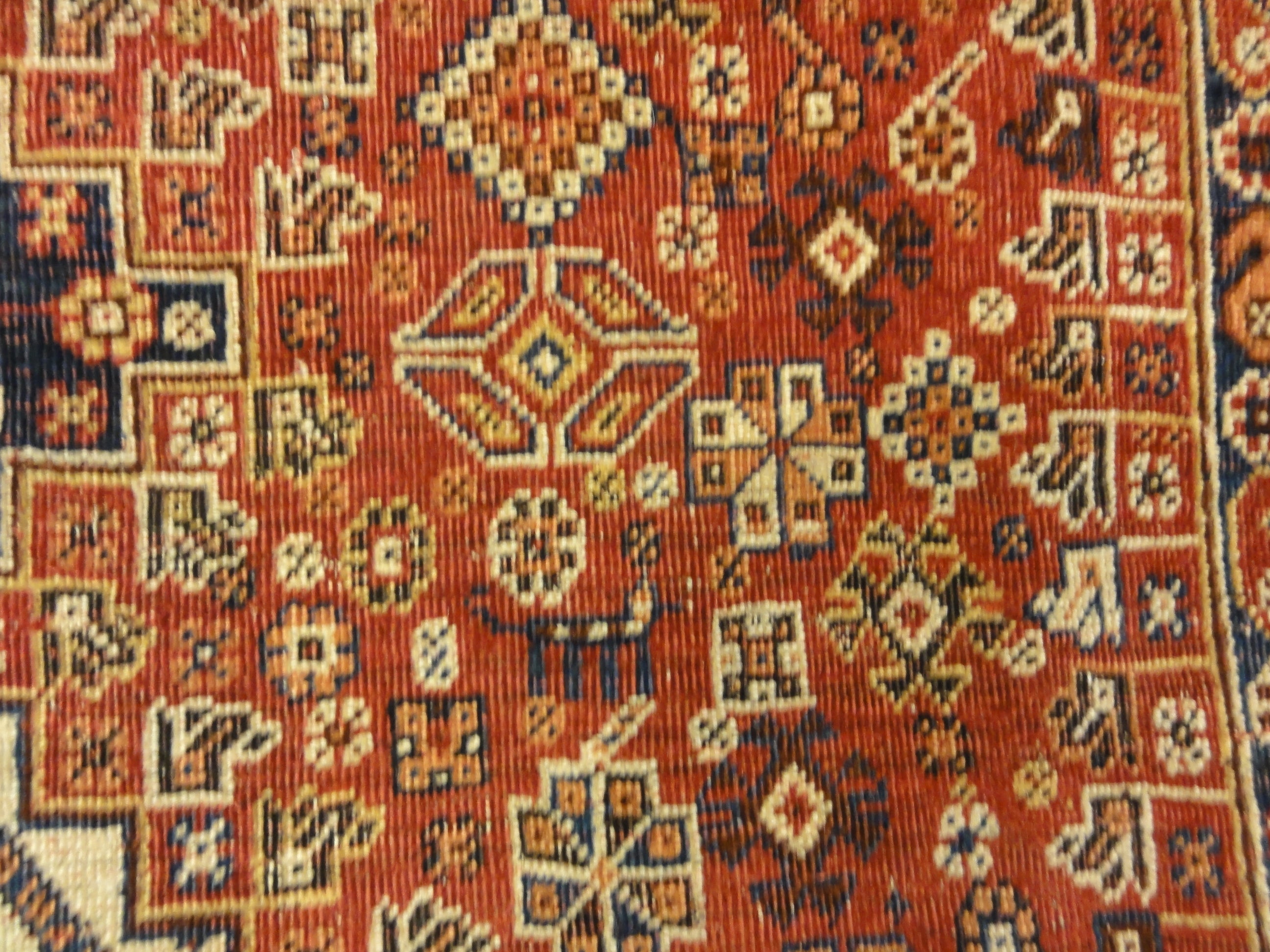 Antique Persian Qashqai Rug. A piece of genuine woven carpet art sold by the Santa Barbara Design Center, Rugs and More in Santa Barbara, California.