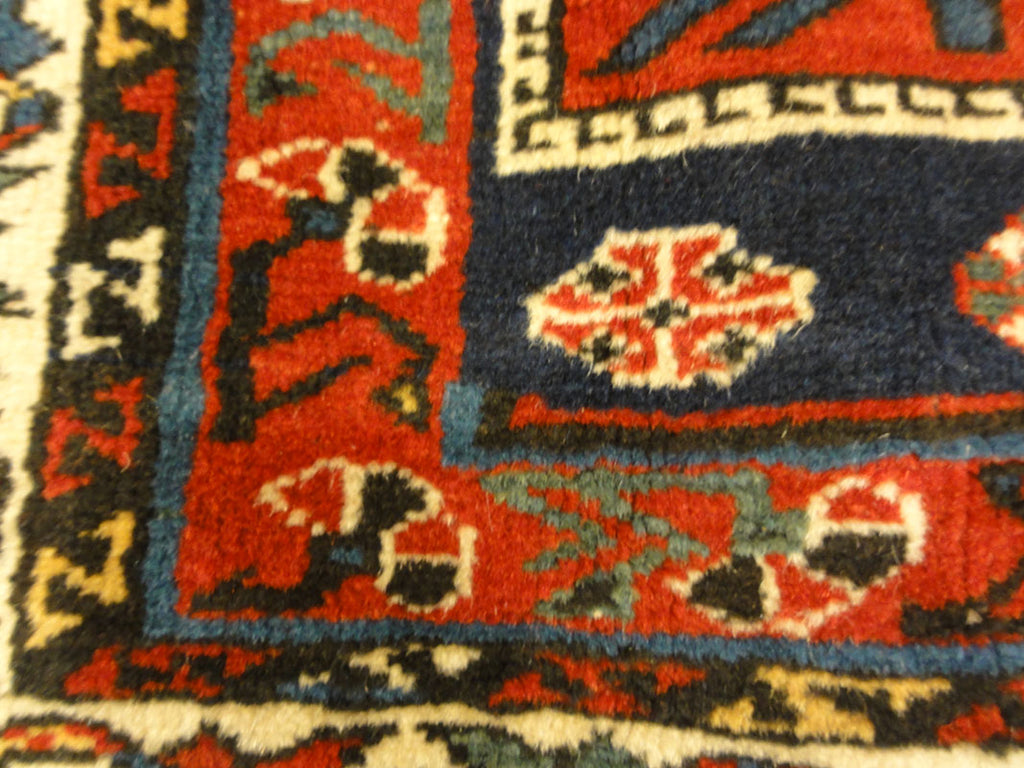 Amazing Caucasian Shirvan Baku Rug. An antique piece of woven carpet art sold by the Santa Barbara Design Center Rugs and More in Santa Barbara, California.