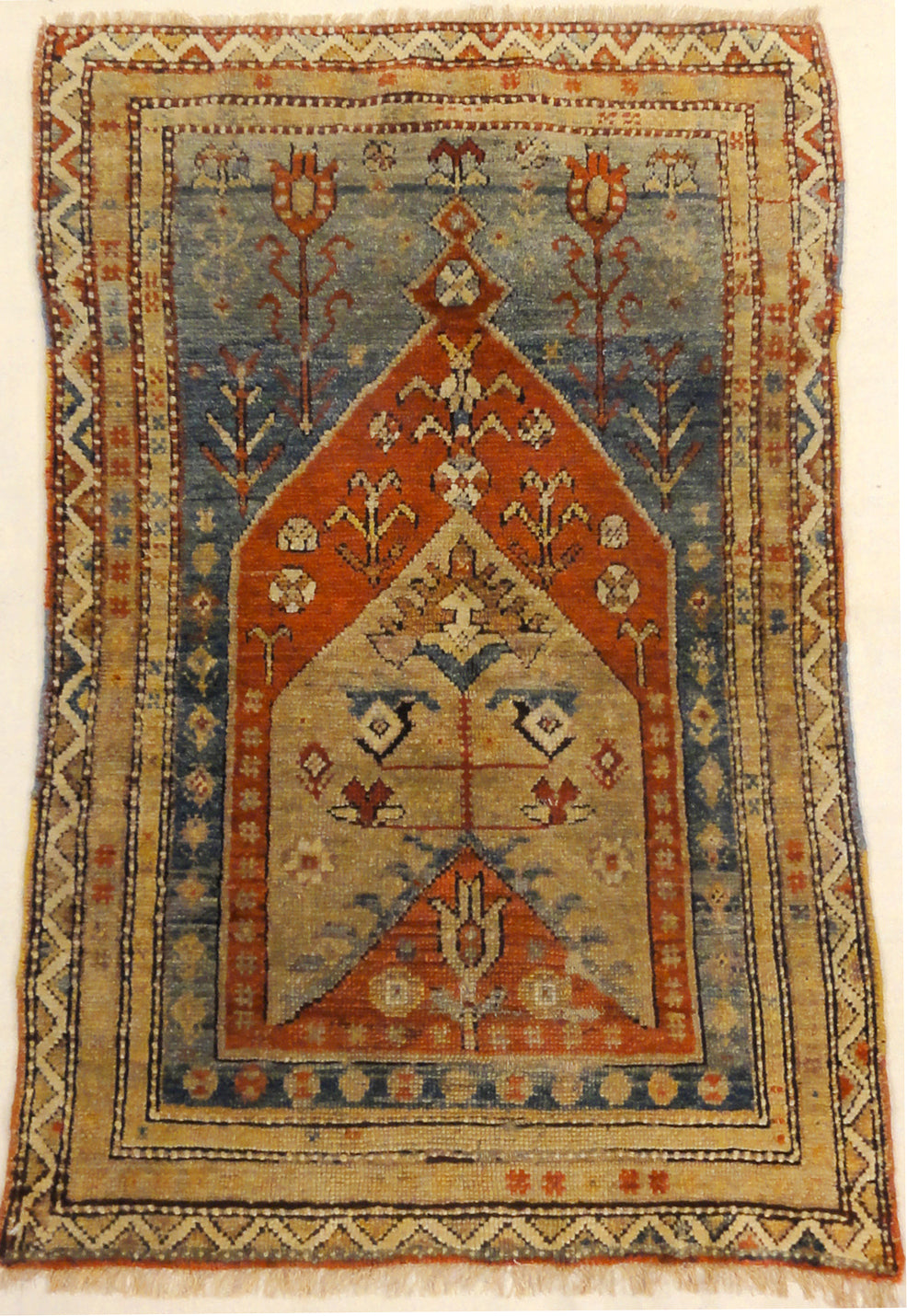 Antique Milas Prayer Rug is a prayer rug of Turkish origin. A piece of genuine woven carpet art sold by Santa Barbara Design Center Rugs and More.