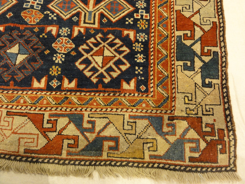 Antique Shirvan Rug Featuring Peacock and Two Men. A genuine authentic antique piece of woven carpet art sold by Santa Barbara Design Center, Rugs and More.