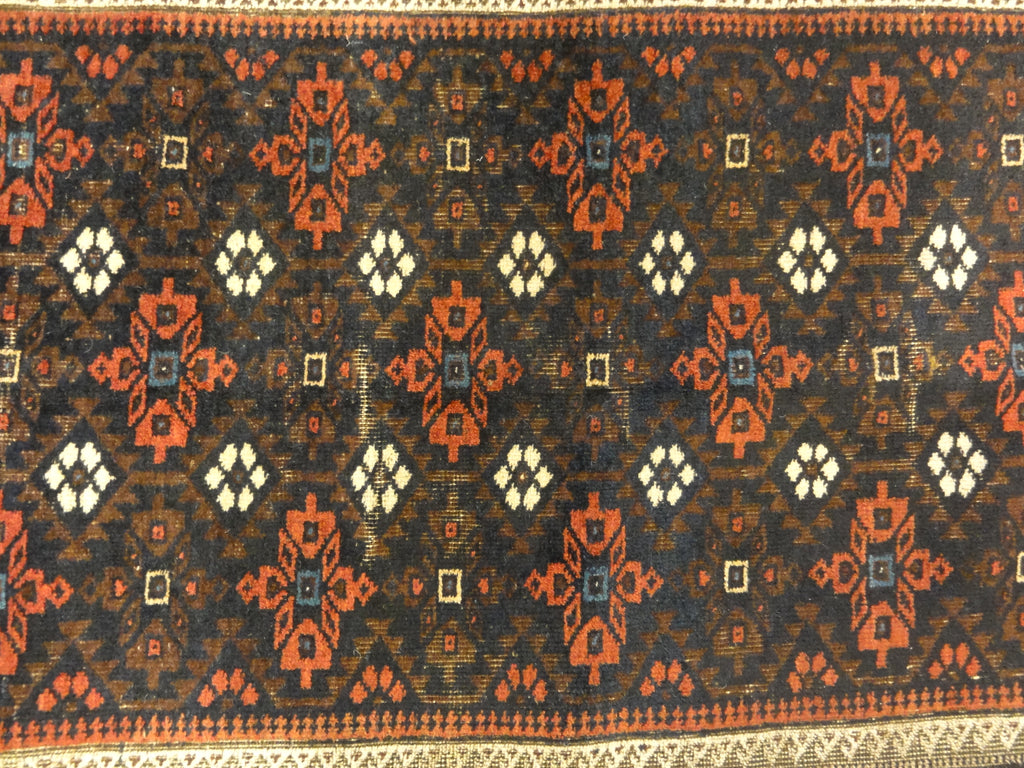 An antique and original burial Baluch dated rug. Dated on all four corners. Used as a casket covering. Sold by Santa Barbara Design Center.