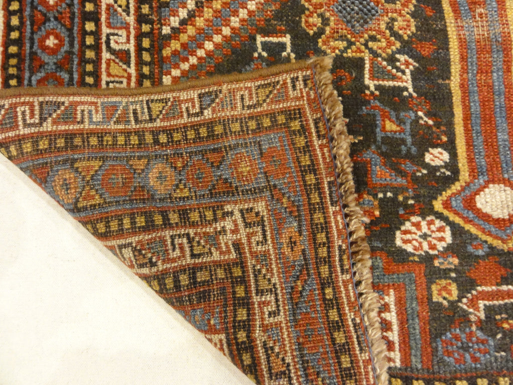 Antique Persian Khamseh Chicken Rug. A piece of genuine woven carpet art sold by Santa Barbara Design Center Rugs and More.