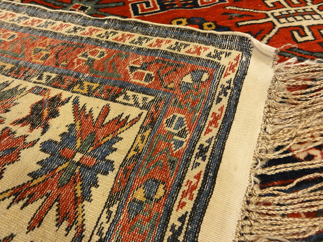Amazing Caucasian Shirvan Baku Rug. An antique piece of woven carpet art sold by the Santa Barbara Design Center Rugs and More in Santa Barbara, California.