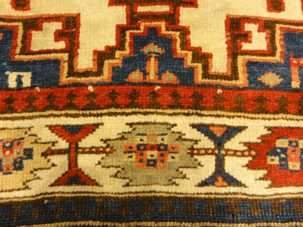 Rare Antique Leshgi Star Rug featuring Men Standing on Horses. A piece of genuine antique authentic woven carpet art sold by Santa Barbara Design Center.