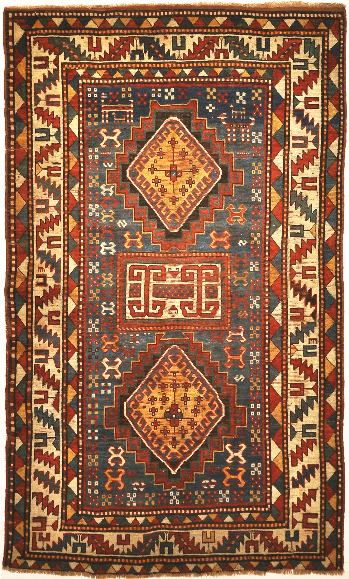 Good Quality Antique Kazak Rug from Early 19th Century. A piece of genuine authentic antique woven carpet art sold by Santa Barbara Design Center.