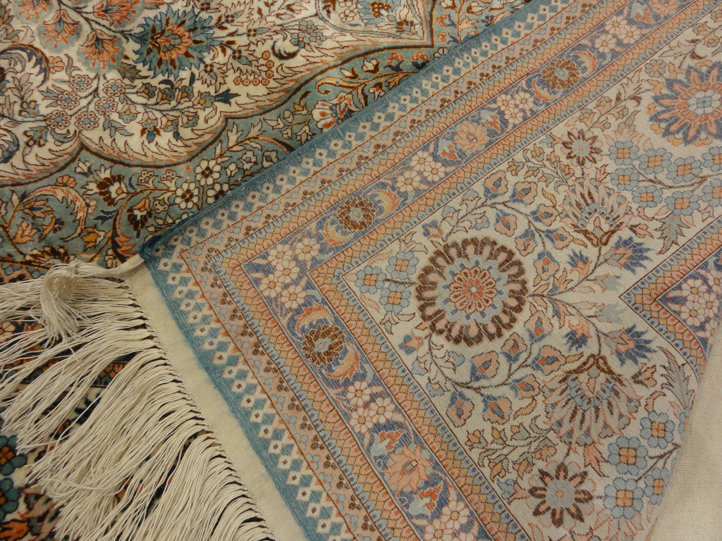 An antique finest silk rug featuring the garden of paradise with 1001 flowers. A piece of genuine woven carpet art sold at Santa Barbara Design Center.