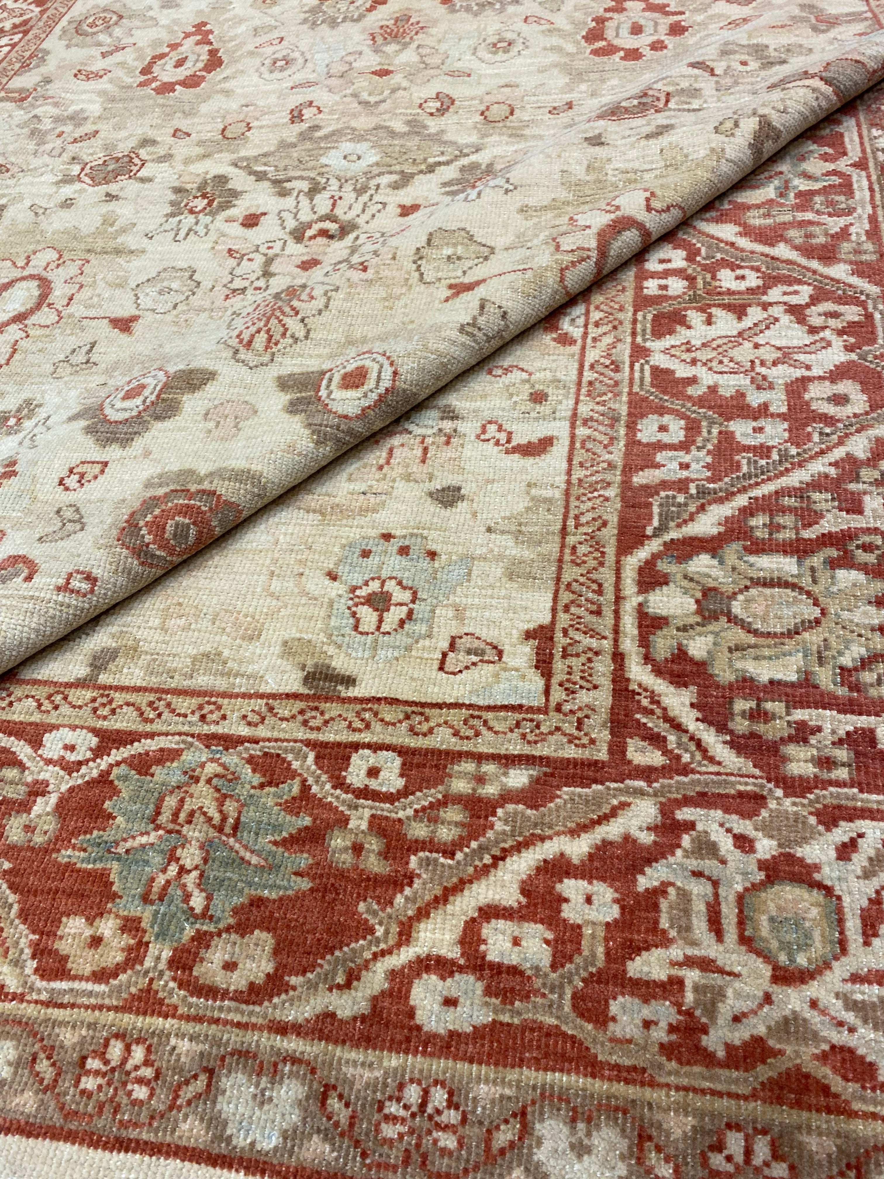 Close-up view of an Original Ziegler &amp; Co. Sultanabad rug featuring intricate floral patterns in beige and red tones.
