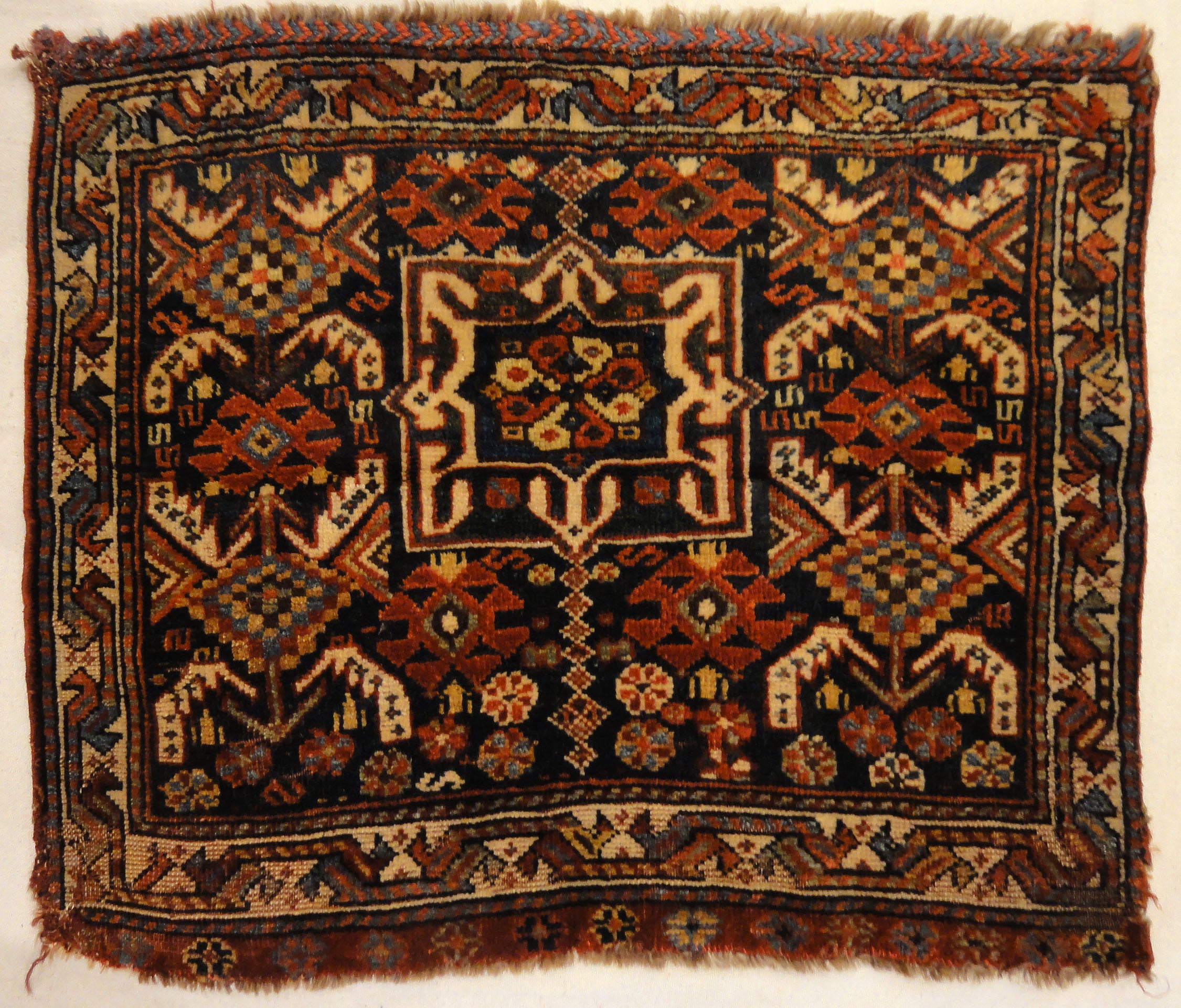 Antique Khamseh Southwest Persian Bagface. A piece of antique woven carpet art sold by Santa Barbara Design Center Rugs and More in Santa Barbara, CA.