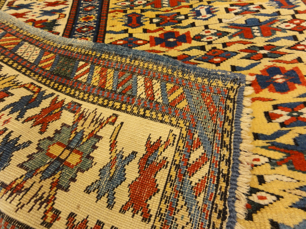 Antique Rare Gold Kuba Chichi Rug. A genuine authentic antique piece of carpet art sold by the Santa Barbara Design Center, Rugs and More.