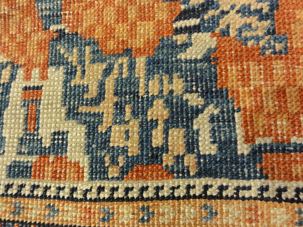 Antique Khamseh with Tribal Flowers. A piece of genuine woven carpet art sold at the Santa Barbara Design Center Rugs and More in Santa Barbara California.