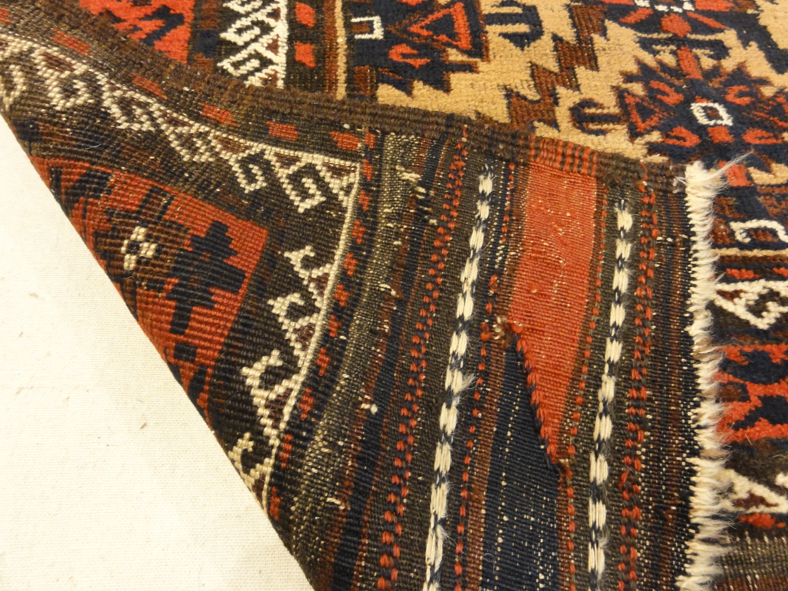 Antique Camelhair Persian Beluch Circa 1900s. A piece of genuine and authentic woven carpet art from Santa Barbara Design Center Rugs and More.