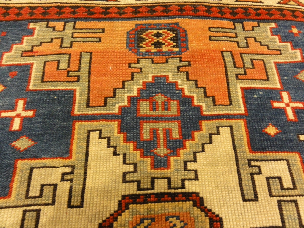 Rare Antique Leshgi Star Rug featuring Men Standing on Horses. A piece of genuine antique authentic woven carpet art sold by Santa Barbara Design Center.