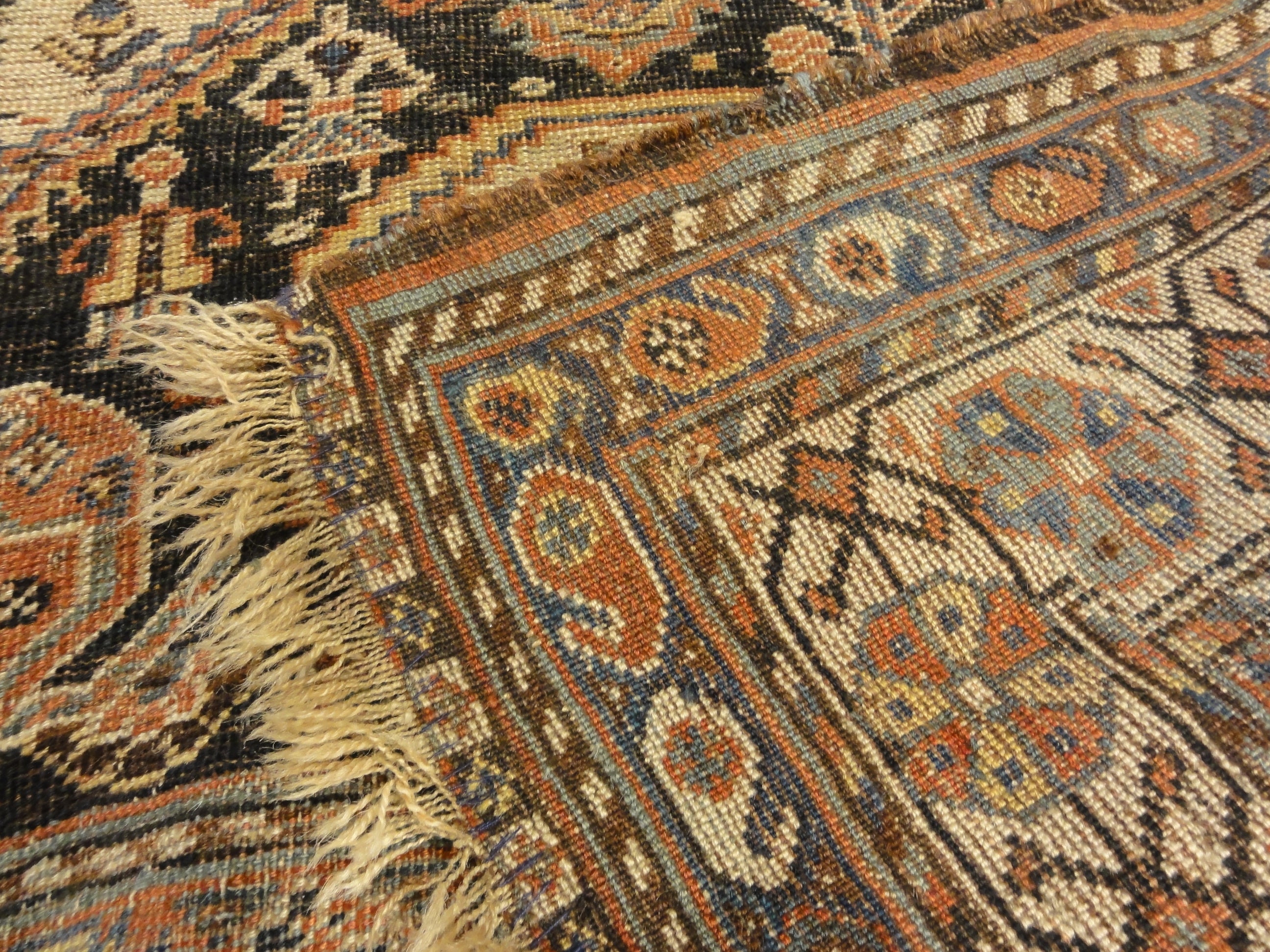 Antique Persian Qashqai featuring Tribal Flowers. A piece of genuine handwoven carpet art sold by Santa Barbara Design Center Rugs and More.