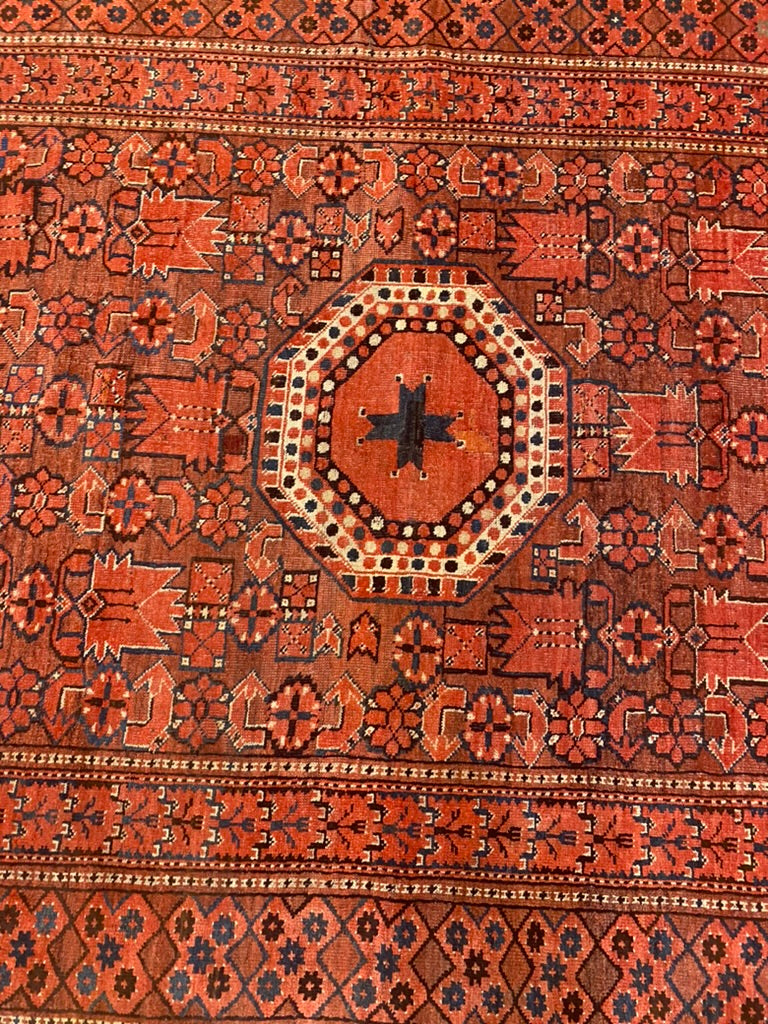 Overhead detailed image of Antique Sari. Vibrant Red hues.