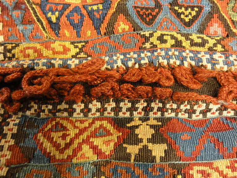 Small Bakhetiari Kelim Saddle Bag some metal threading throughout. Visit us Rugs & More in the Santa Barbara Design Center.