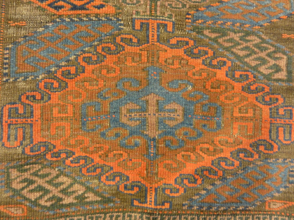 An antique original Mushwani Baluch rug handwoven in Afghanistan. A piece of genuine, authentic woven carpet art. Sold by Santa Barbara Design Center.