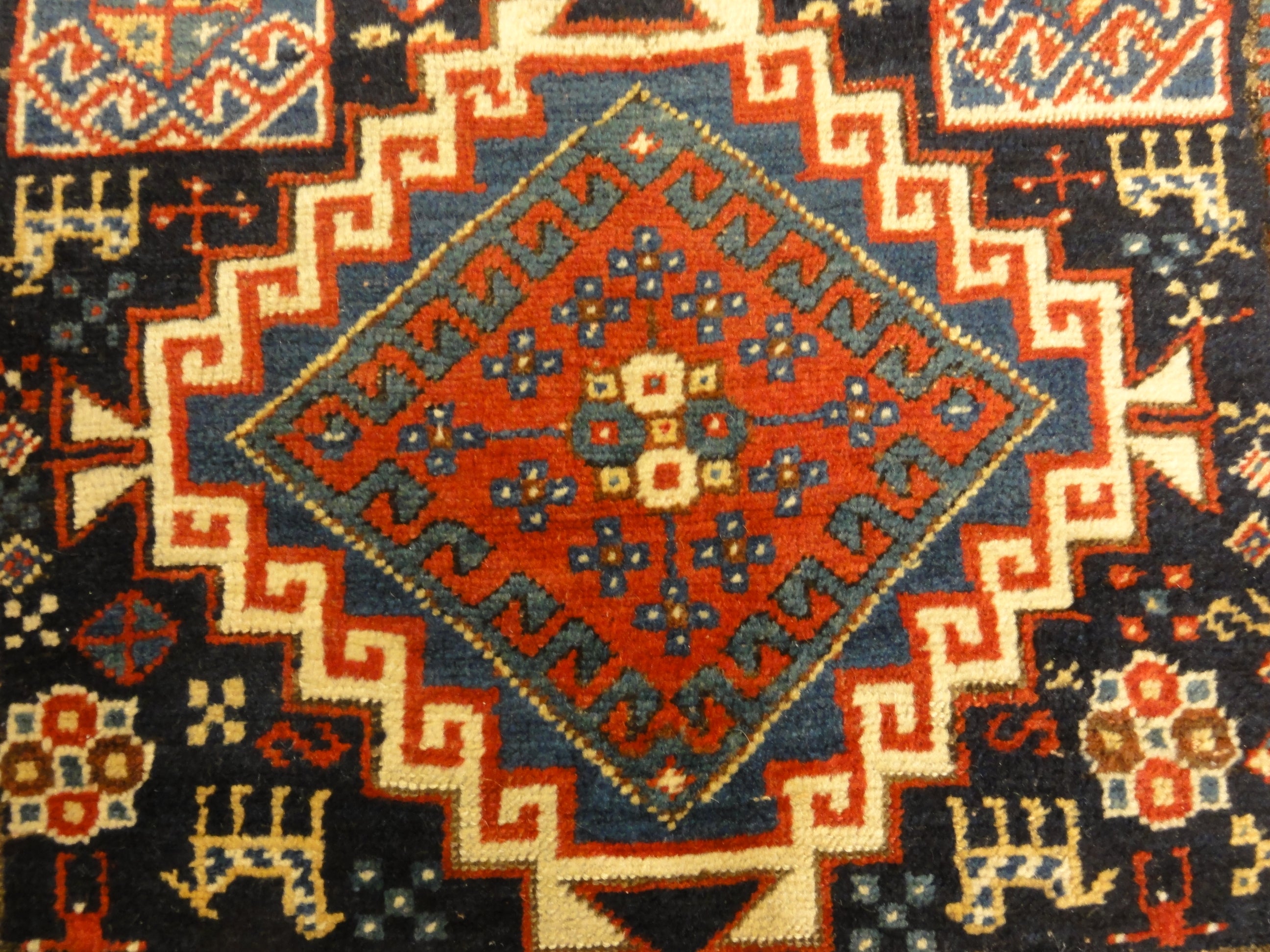 Caucasian Marriage Rug From 1880s. A piece of genuine antique woven carpet art sold by the Santa Barbara Design Center, Rugs and More.
