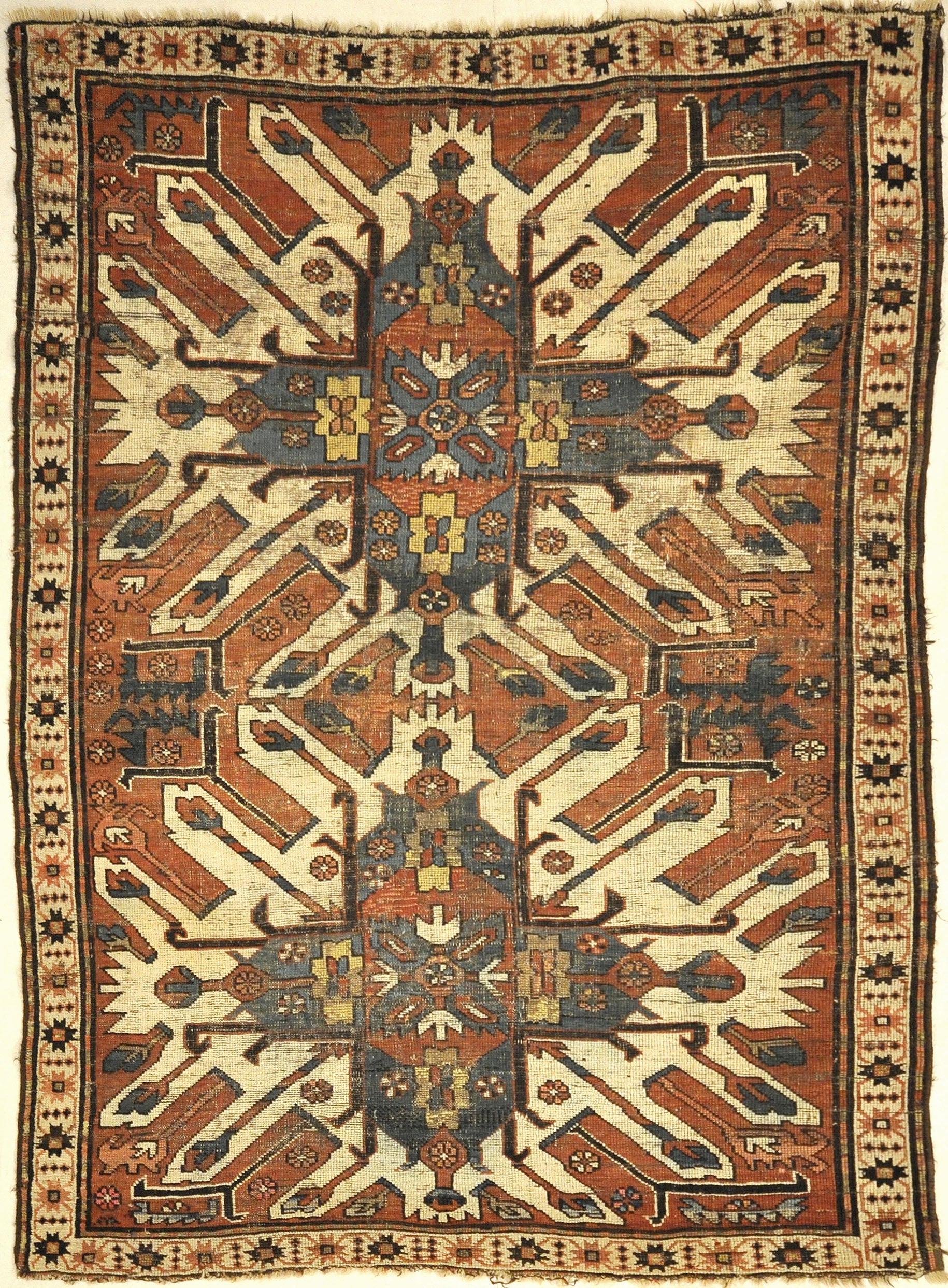 Antique Eagle Kazak Chelaberd Rug. A piece of genuine authentic woven carpet art sold by Santa Barbara Design Center Rugs and More.