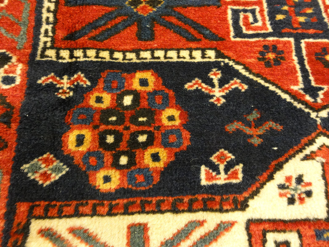 Amazing Caucasian Shirvan Baku Rug. An antique piece of woven carpet art sold by the Santa Barbara Design Center Rugs and More in Santa Barbara, California.