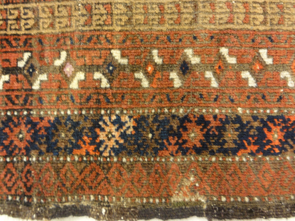 An antique, original Persian Baluch rug. A piece of genuine and authentic carpet art sold at Santa Barbara Design Center. Rugs and More.