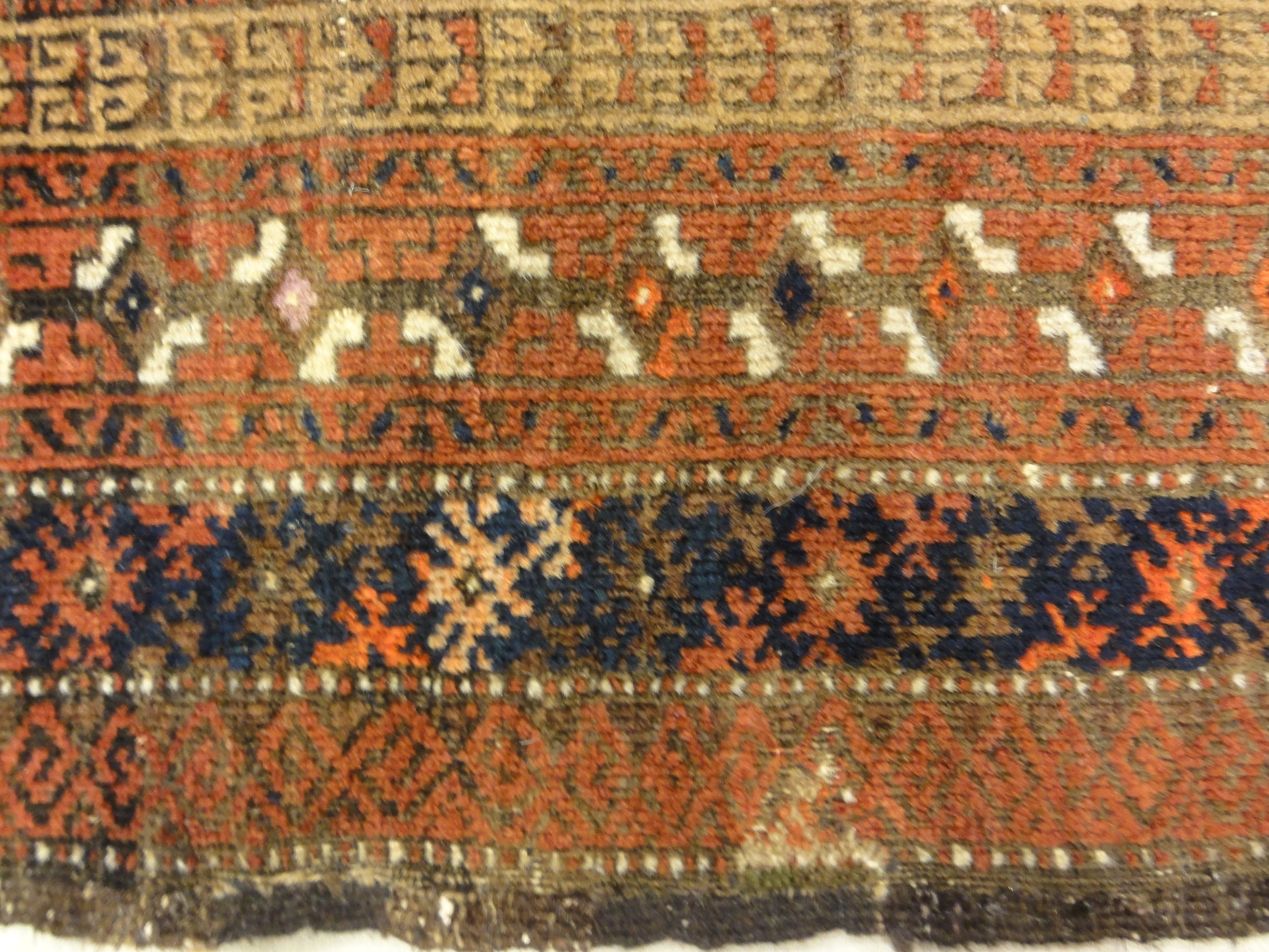An antique, original Persian Baluch rug. A piece of genuine and authentic carpet art sold at Santa Barbara Design Center. Rugs and More.