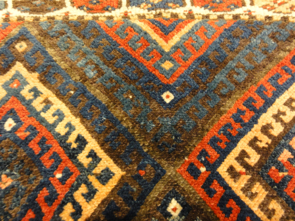 Kurdish Bagface Jaf Kurd. A genuine, antique piece of woven carpet art sold by Rugs & More in the Santa Barbara Design Center.