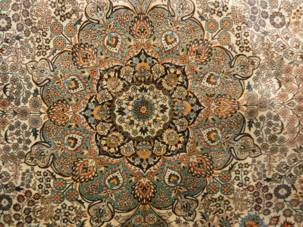 An antique finest silk rug featuring the garden of paradise with 1001 flowers. A piece of genuine woven carpet art sold at Santa Barbara Design Center.