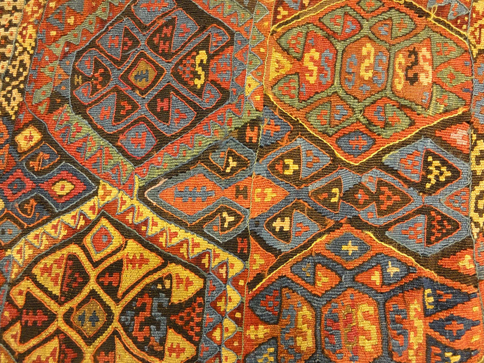 Small Bakhetiari Kelim Saddle Bag some metal threading throughout. Visit us Rugs & More in the Santa Barbara Design Center.