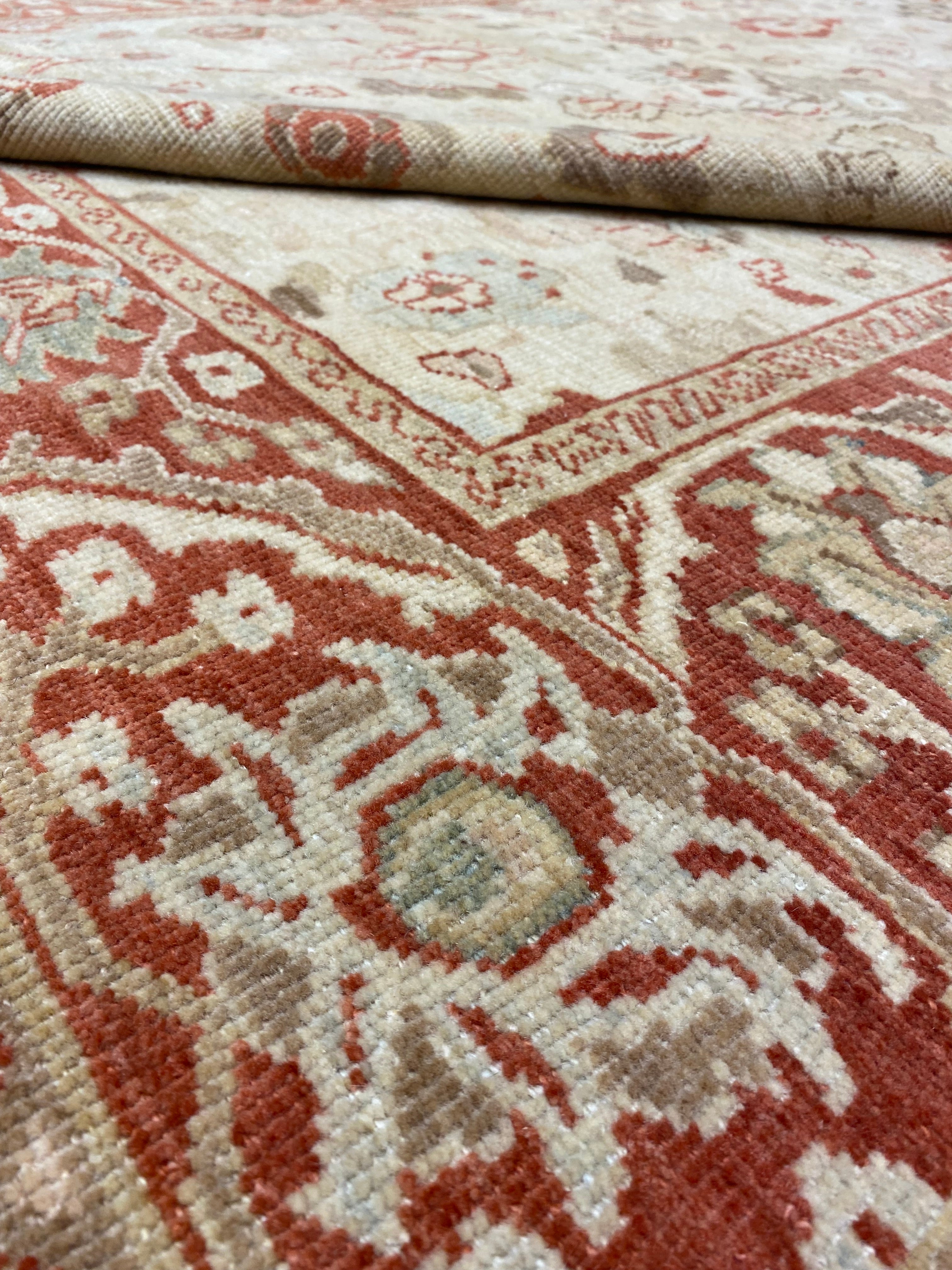 Close-up of a traditional Original Ziegler &#038; Co. Sultanabad rug showing intricate floral patterns in red and beige tones.