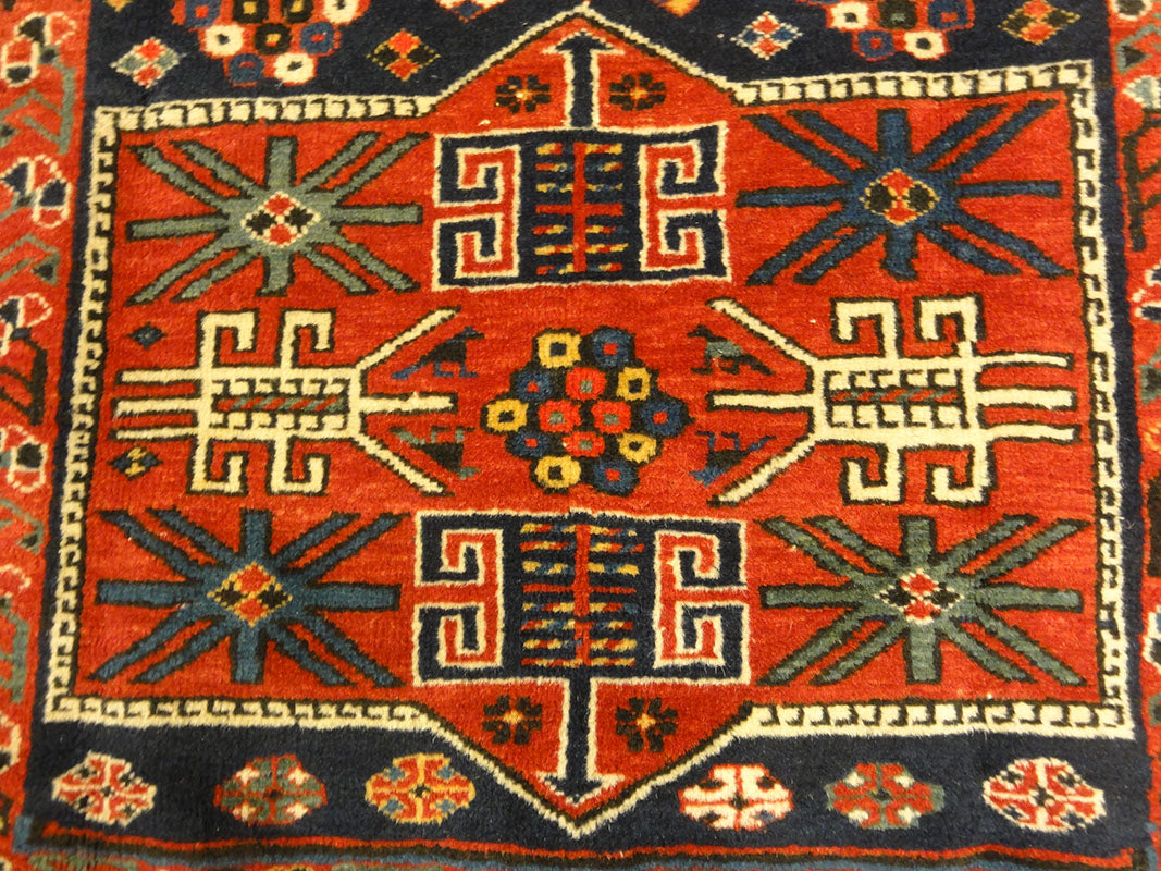 Amazing Caucasian Shirvan Baku Rug. An antique piece of woven carpet art sold by the Santa Barbara Design Center Rugs and More in Santa Barbara, California.
