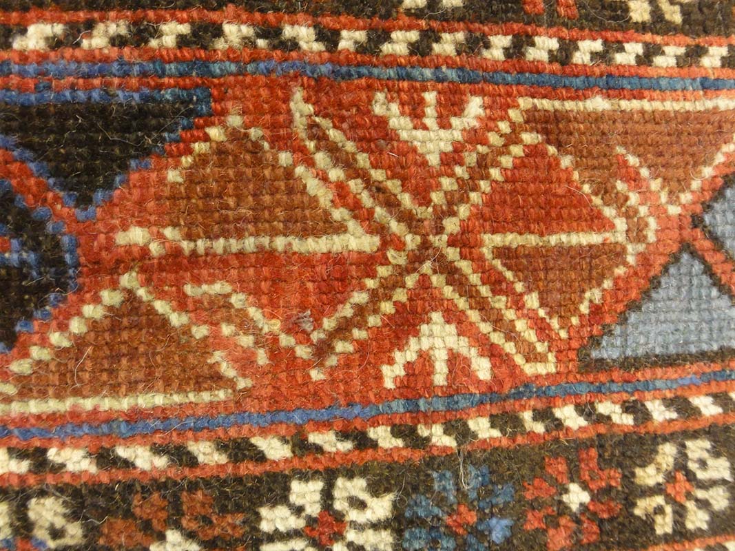 Antique Caucasian Shirvan Botteh Motif. Antique piece of woven carpet art sold by the Santa Barbara Design Center, Rugs and More in Santa Barbara, CA