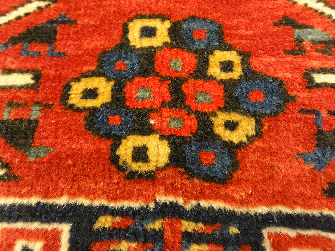Amazing Caucasian Shirvan Baku Rug. An antique piece of woven carpet art sold by the Santa Barbara Design Center Rugs and More in Santa Barbara, California.