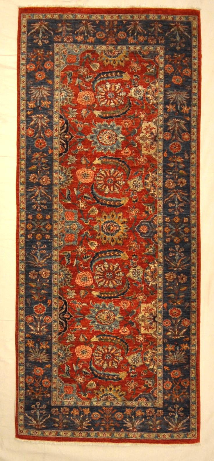 Fine Mughal Runner hand knotted of fine wool and organic dyes. These are the perfect colors to incorporate into your home. 