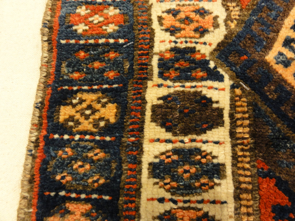 Kurdish Bagface Jaf Kurd. A genuine, antique piece of woven carpet art sold by Rugs & More in the Santa Barbara Design Center.