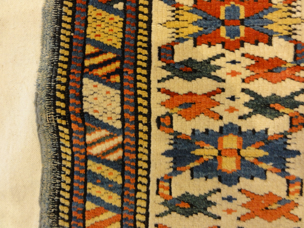 Antique Rare Gold Kuba Chichi Rug. A genuine authentic antique piece of carpet art sold by the Santa Barbara Design Center, Rugs and More.