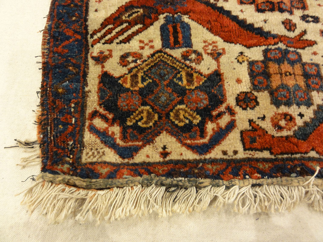 Antique Afshar Featuring Dragon and Phoenix Fight. A piece of antique woven carpet art sold by the Santa Barbara Design Center Rugs and More.