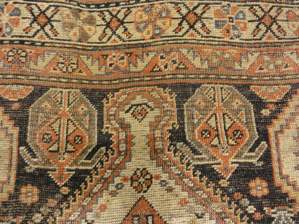 Antique Persian Qashqai featuring Tribal Flowers. A piece of genuine handwoven carpet art sold by Santa Barbara Design Center Rugs and More.