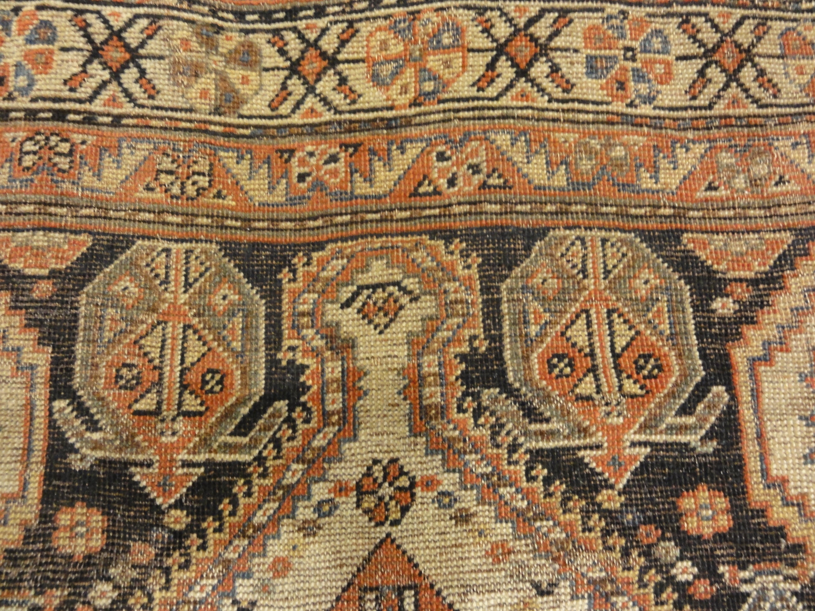 Antique Persian Qashqai featuring Tribal Flowers. A piece of genuine handwoven carpet art sold by Santa Barbara Design Center Rugs and More.