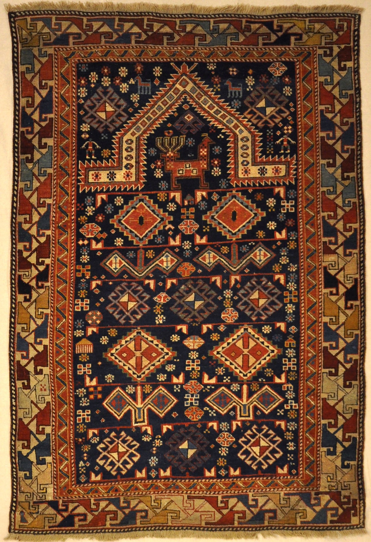 Antique Shirvan Rug Featuring Peacock and Two Men. A genuine authentic antique piece of woven carpet art sold by Santa Barbara Design Center, Rugs and More.