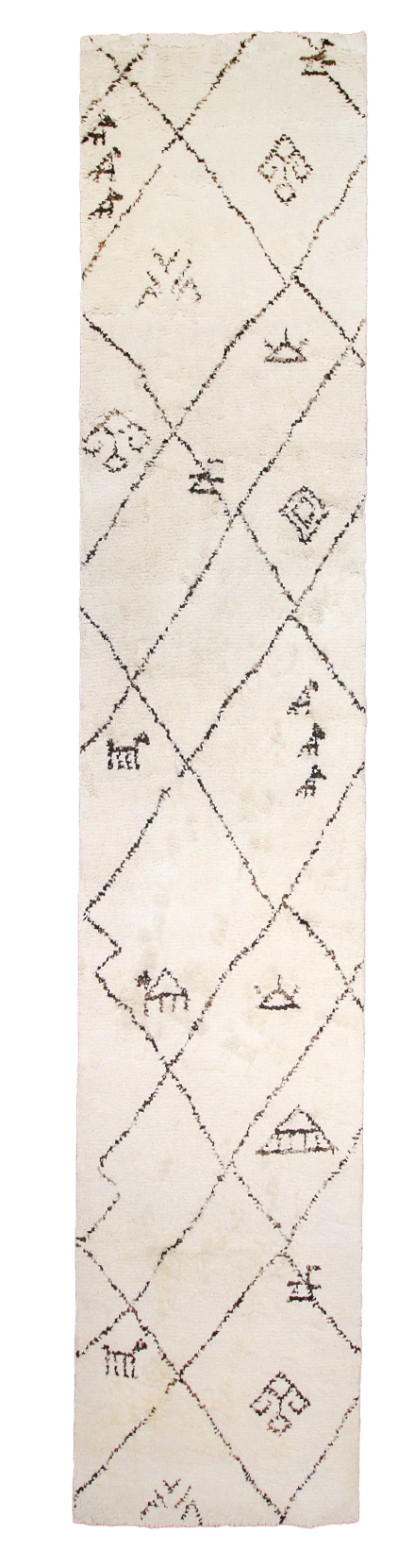 Santa Barbara Chic Moroccan rug with geometric diamond patterns and abstract black line designs on a white background.