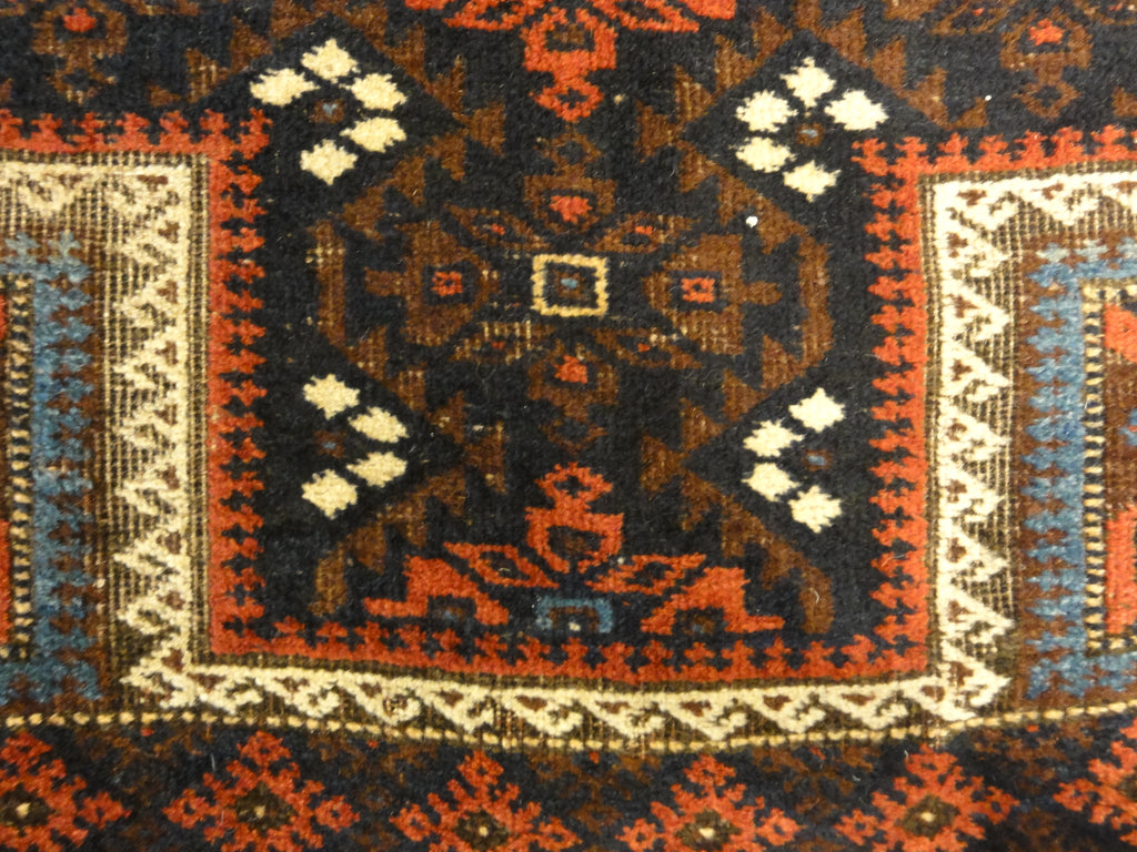 An antique and original burial Baluch dated rug. Dated on all four corners. Used as a casket covering. Sold by Santa Barbara Design Center.